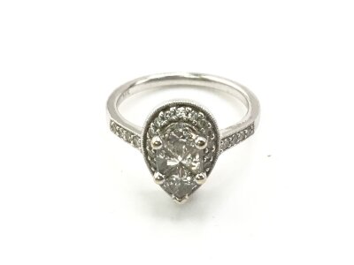 An 18ct white gold ring set with a pattern of diamonds. 
M 1/2 and 5g