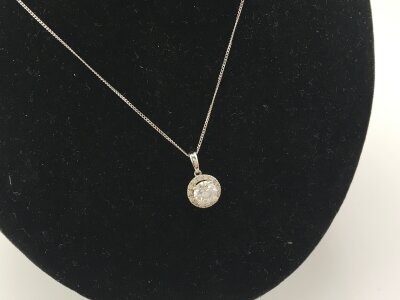 A 9ct white gold necklace set with a CZ pendant.
1.79g- NO RESERVE