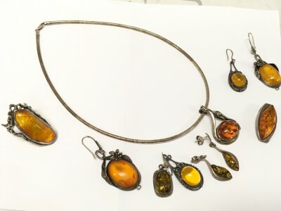 A small collection of silver and amber jewellery including a necklace, ring, earrings etc