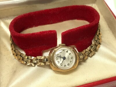 A boxed 9ct gold cased Sekonda ladies watch, rolled gold strap. 13.1g