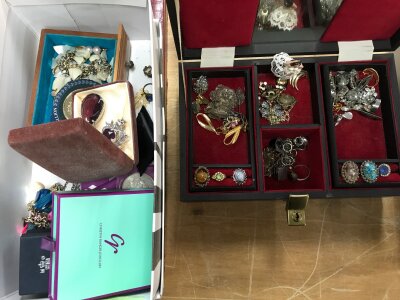 Two boxes of various costume jewellery including brooches, rings, etc