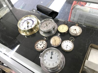 A collection of pocket watches and small clocks, one pocket watch silver cased, Avia battery operated clock,