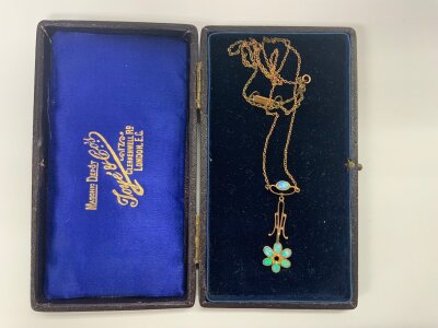 A small Edwardian necklace set with opals. (Some restoration needed)