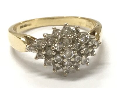 A 9ct gold diamond cluster ring size N. 2.9g