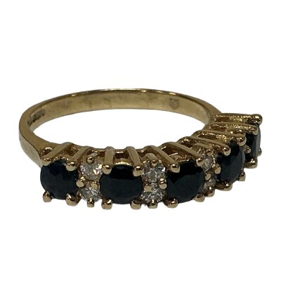 A 9ct gold sapphire and white stone set ring. Size M.