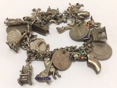 A silver charm bracelet, 80g total weight