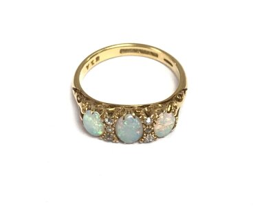 An 18ct gold Opal ring. Size L 1/2 and 3.68g