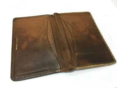 A gold mounted leather Asprey’s wallet . 7x11cm