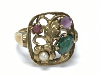 A 9ct unmarked ring set with emerald, ruby etc stones. Size N. 3.4g total weight