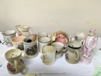 A Collection of ceramics Shaving mugs a bisque dolls head Victorian cups and other associated ceramics.- NO RESERVE
