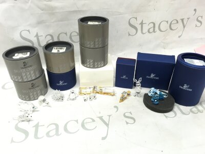 A collection of boxed Swarovski figures including Disney piglet , animals, train sets