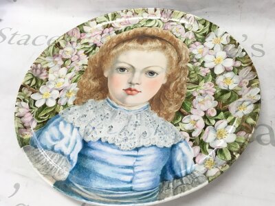 A Victorian hand painted wall plaque portrait of a young girl, Nellie Daughter of the Reverend E, Du Pre painted by M+D. 42cm wide