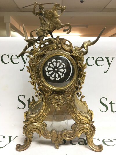An antique rococo style french brass coloured mantle clock case.- NO RESERVE