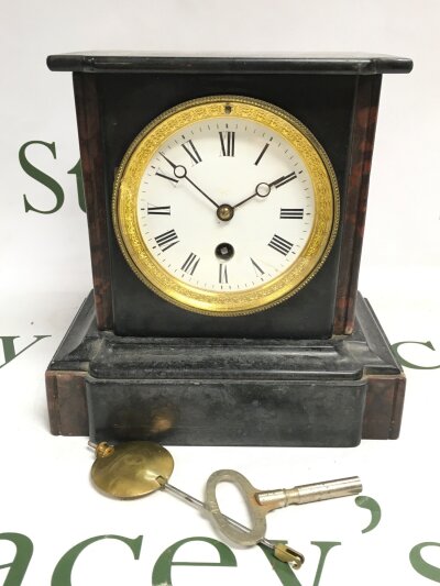 An antique french marble mantle clock with a guilt bezel.- NO RESERVE