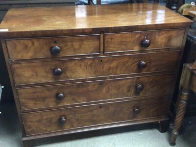 An Early Victorian Mahogany chest of drawers fitted with two short and three long drawers on bracket feet. Length 112cm