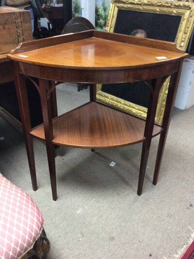 A mahogany occasional corner display table.with four square tapering legs and ope under tier.- NO RESERVE