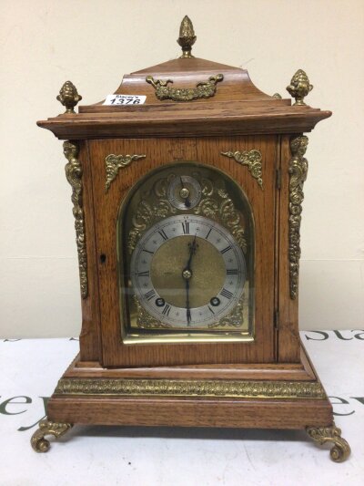 A quality Edwardian Oak mantel clock embellished with gilded brass mounts eight day going with second subsidiary dial Height 45cm