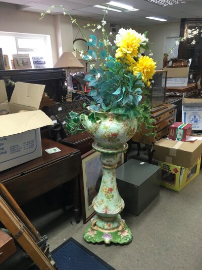 A Victorian ceramic jardiniere and pedestal, with floral decoration. 105cm tall.