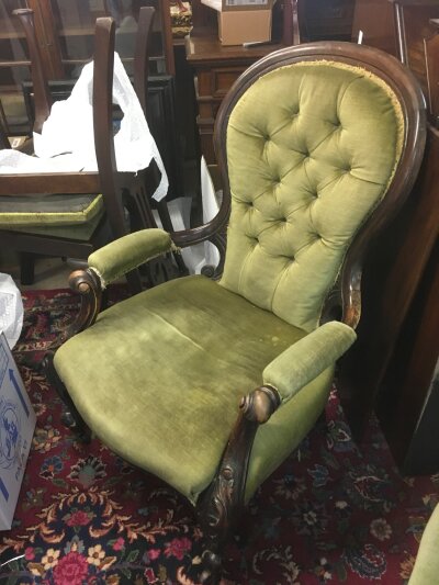 A Victorian open armchair. Dimensions 66cm wide, 97cm tall 60cm deep