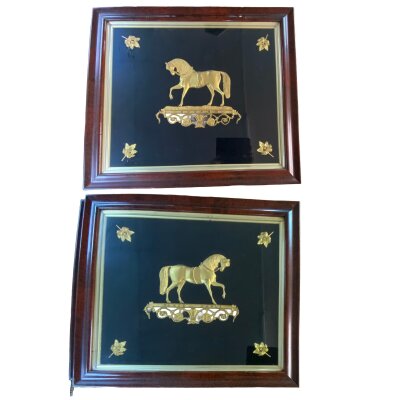 A pair of framed and glazed  gilt metal plaques titled Ducrow and Black Eagle show horses  (Possible connection with Andrew Ducrow, Circus Performer Covent Garden 1780). 84cm x 64cm.