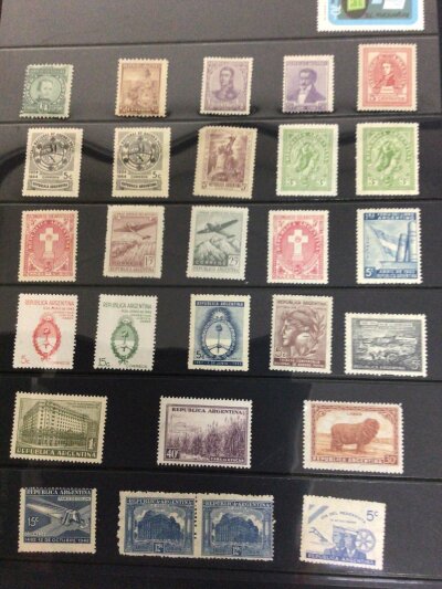 An Album containing Mint Argentina Republic stamps loose stamps on sheets mainly used foreign stamps and one other conforming album of Argentinian stamps.