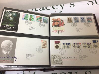 A collection of first day covers in albums and loose covers including a few presentation packs. In a large plastic box.