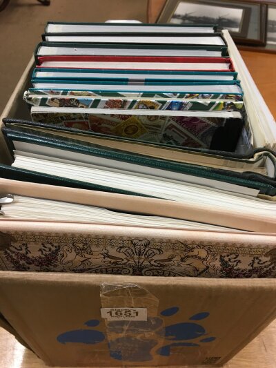 A box containing a collection 14 albums of World stamps