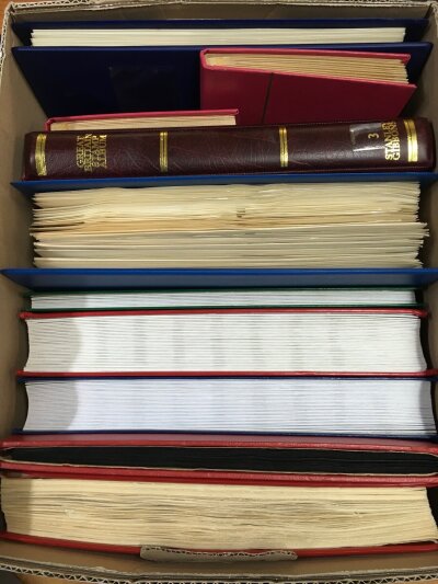 A box containing 10 albums of various stamps and covers