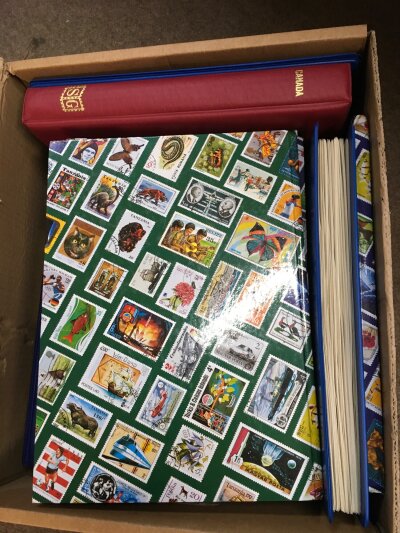 A box containing 13 albums of various World stamps including Canada