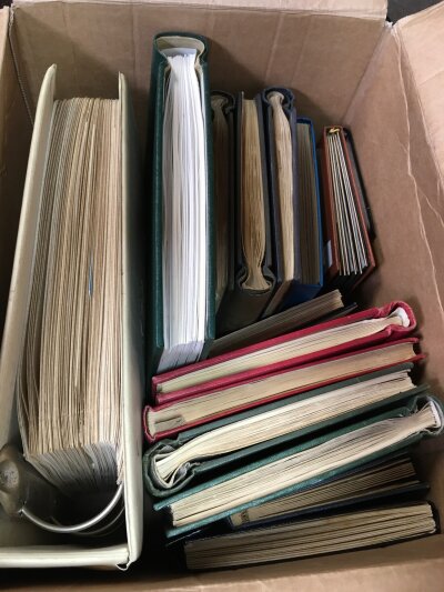 A box containing 17 albums of various World stamps