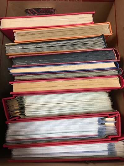 A box containing 10 albums of various stamps including Jersey and Guernsey with First Day Covers