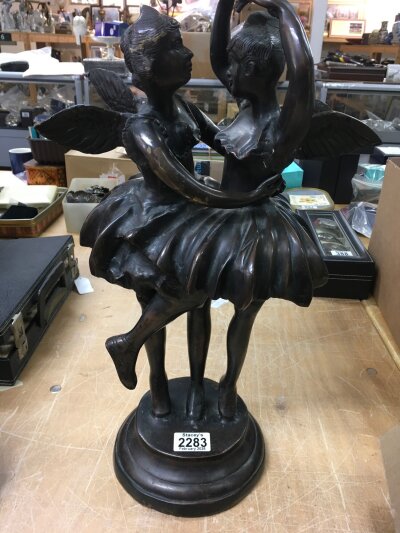 A bronze figure in the form of two dancing fairies.- NO RESERVE