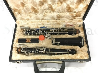 A Howard Romeo Orsi Milano oboe in a fitted case