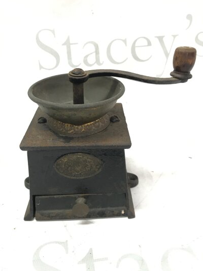 A vintage Kendrick and Sons cast iron coffee grinder, 16.5cm tall