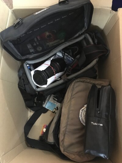 A collection of camera equipment including Tokina lenses