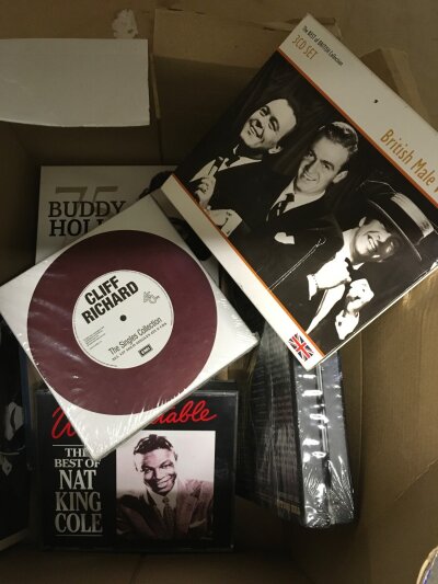 A box containing various music disc's including Buddy Holly, Cliff Richard, Nat King Cole etc
