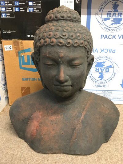A terracotta Buddha bust, 52cm tall 48cm wide