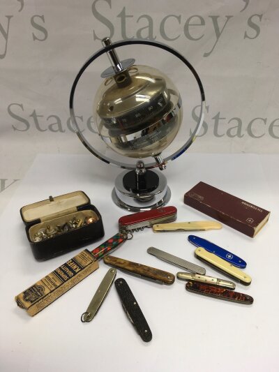 A collection of oddments comprising various penknives, cufflinks, Huger globe barometer etc.