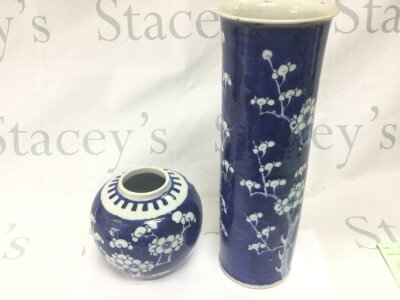 A Chinese ginger jar featuring a cherry blossom deign and a sleeve vase again with cherry blossom design.