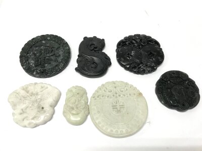 Seven Chinese jade pendants , 4-5cm wide . No reserve