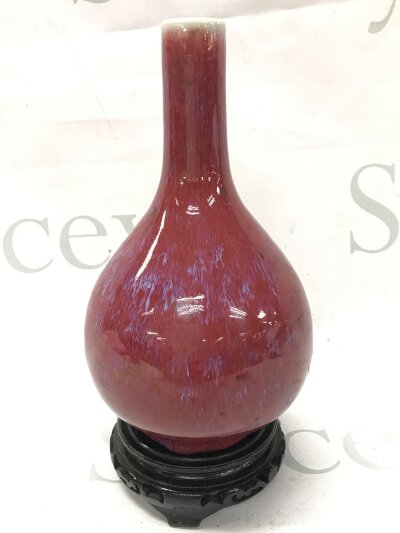 A Chinese Flambe glazed vase with stand. 21cm tall