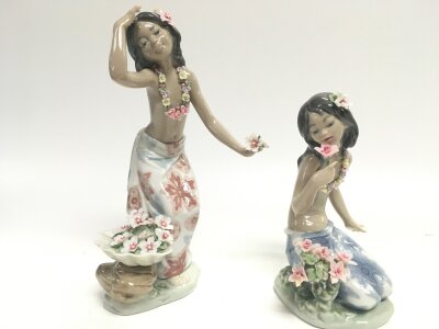Two boxed porcelain Lladro Hawaiian girl figures