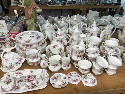 A Royal Doulton dinner/tea service in the Lavender Rose pattern- including lidded tureen, coffee pot, tea pot, dinner plates, cups and saucers etc
