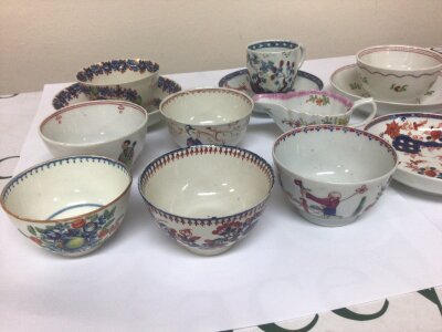 A Collection of 18th century English porcelain tea bowls a small cream jug and cups and saucers decorated in the oriental style. some hairline cracks etc.