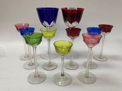 A collection of various glassware to include a Waterford decanter, hallmarked silver topped decanter, etc…