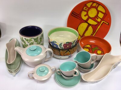 Two boxes of Poole and other ceramics including a two tone tea set, charger, plates etc.