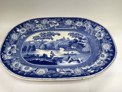 A blue and white meat plate depicting a pastoral countryside scene, approx width 53.5cm.
