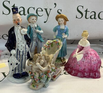 A collection of five decorative porcelain figurines (German style) this includes a clown, matching pair of rococo style pastoral figures, a ‘Royal Doulton’ ceramic women, figurative porcelain slipper vase.