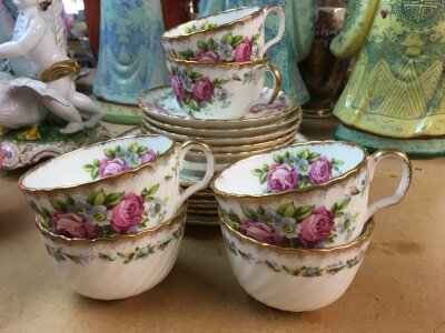 A Royal Albert style part set decorated with flowers and foliage