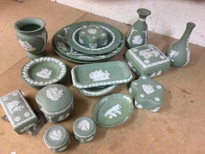 A small collection of Green ground Wedgwood pieces including trinket boxes and bud vases